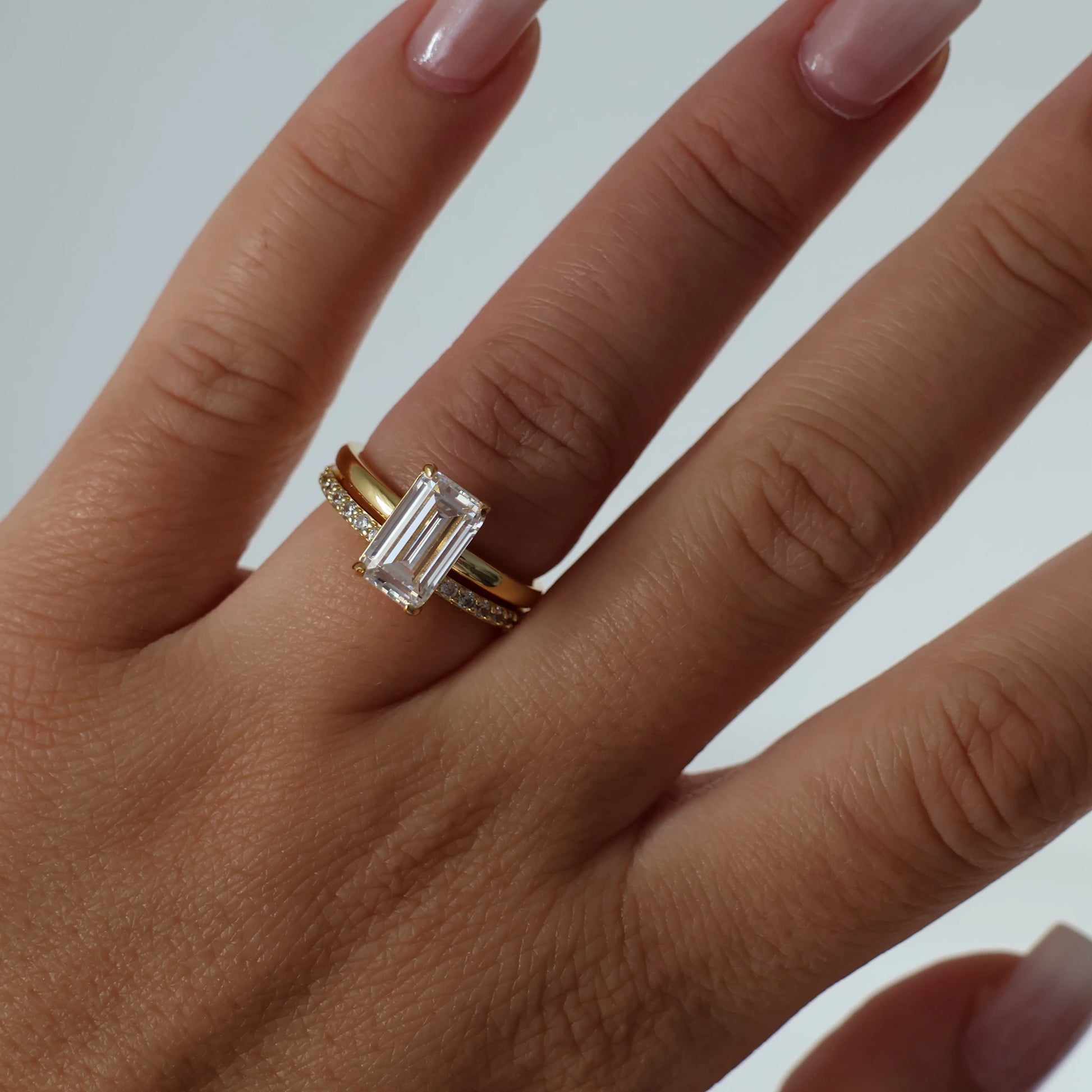 Gold 3 carat elongated emerald cut cubic zirconia ring