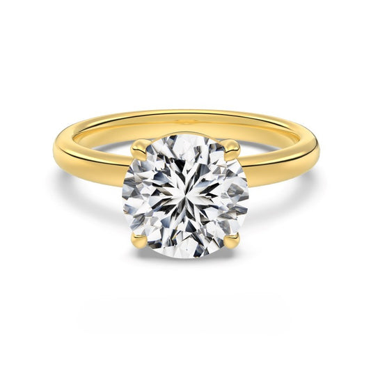 3 carat round cut gold ring on white background