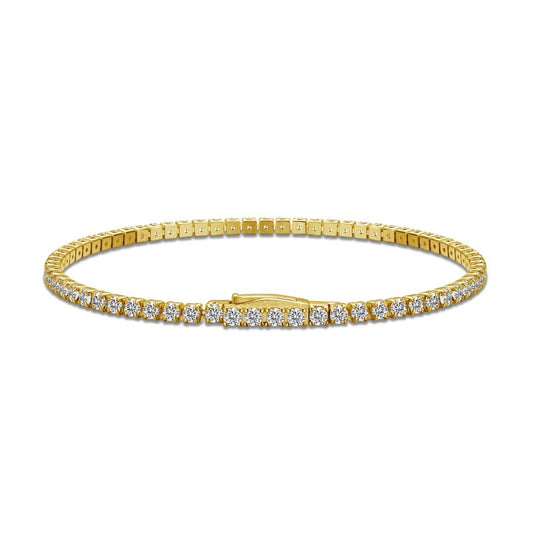 gold tennis bracelet 2.5mm with cz stones side on plaine white background