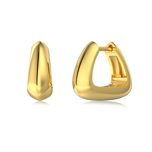 gold trapeze huggie earrings on white background