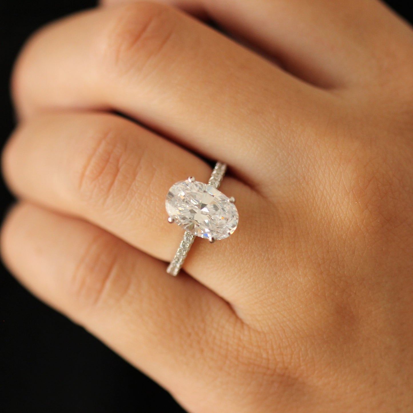 3.5 carat silver oval ring on half pave band