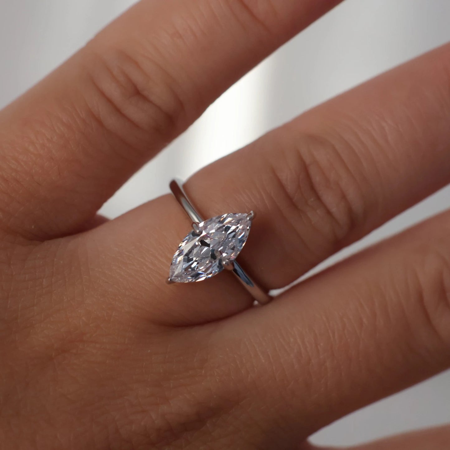 Close up of marquise cut cubic zirconia in silver solitaire setting