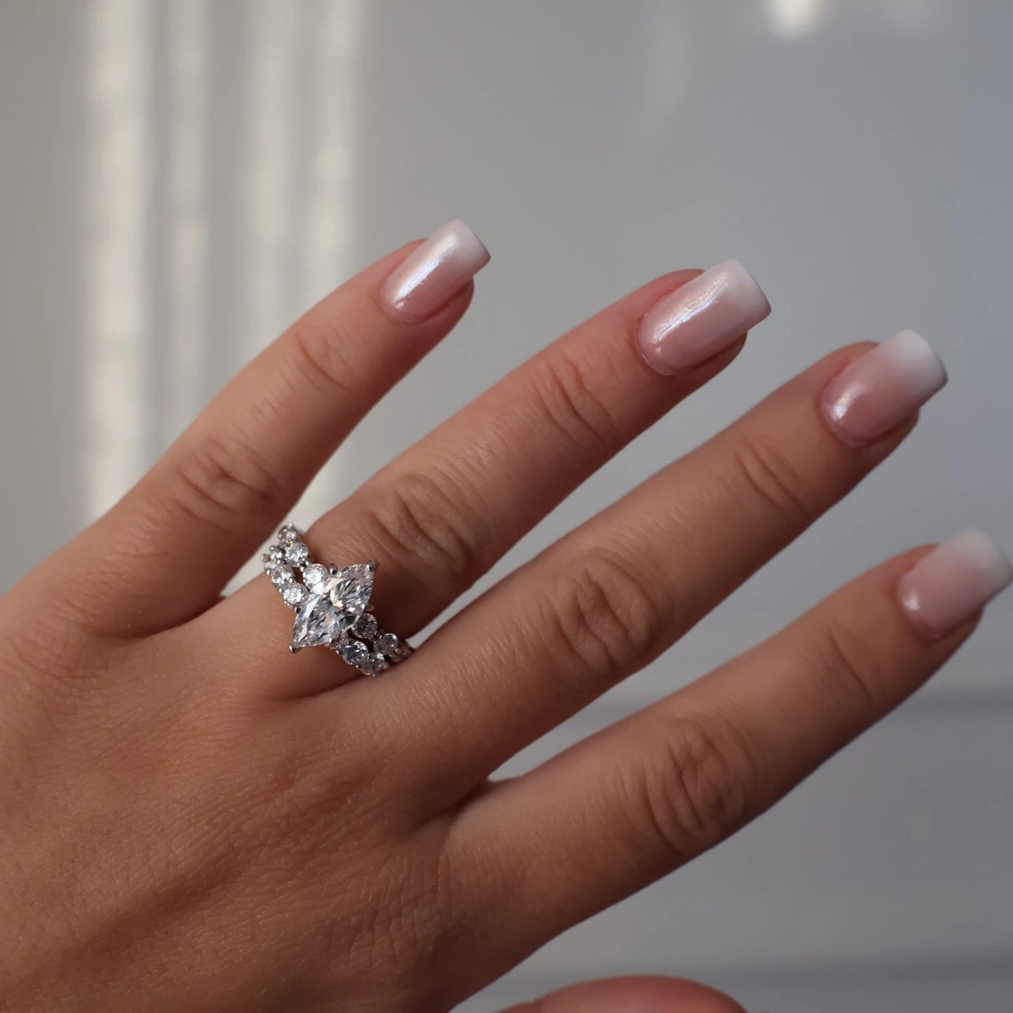 silver marquise ring with round floating band stack