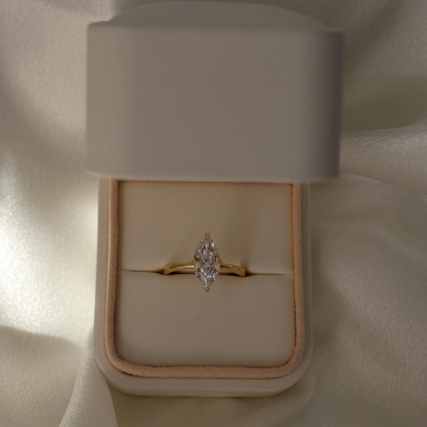 marquise CZ gold solitaire ring in proposal box