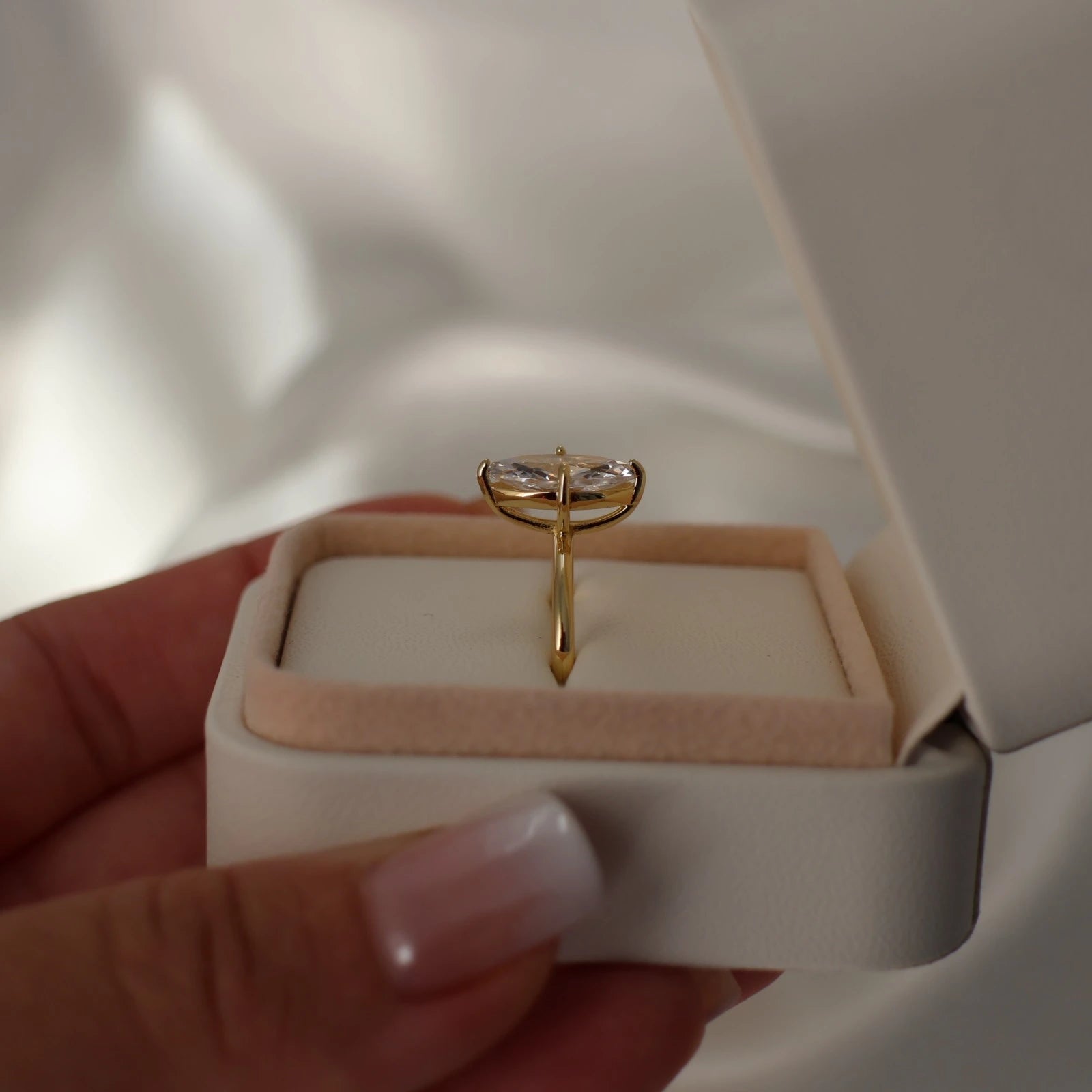 side view of marquise CZ gold solitaire ring
