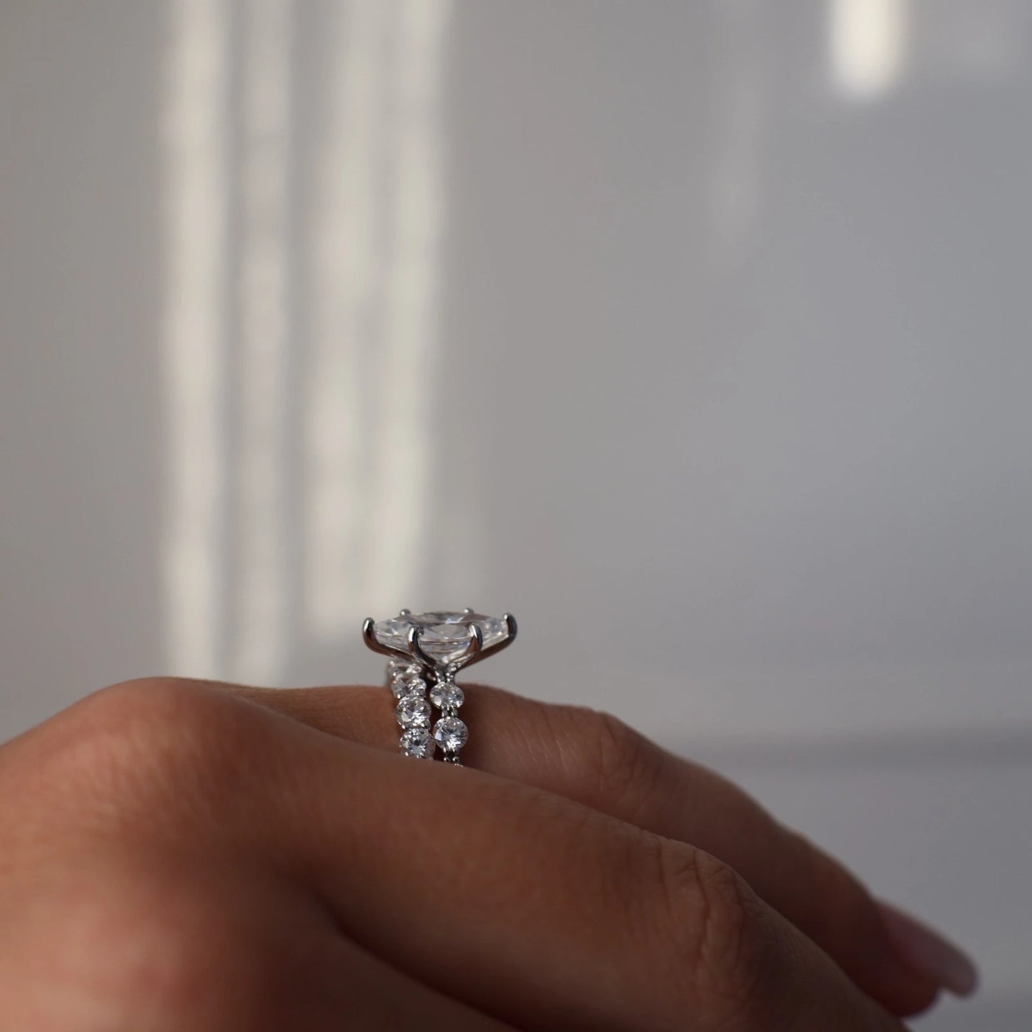 side profile of marquise ring in silver with round floating band