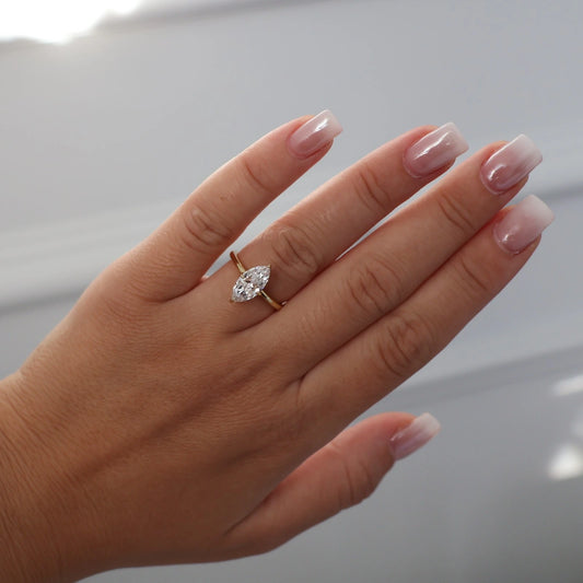 Marquise solitaire cubic zirconia engagement ring in gold