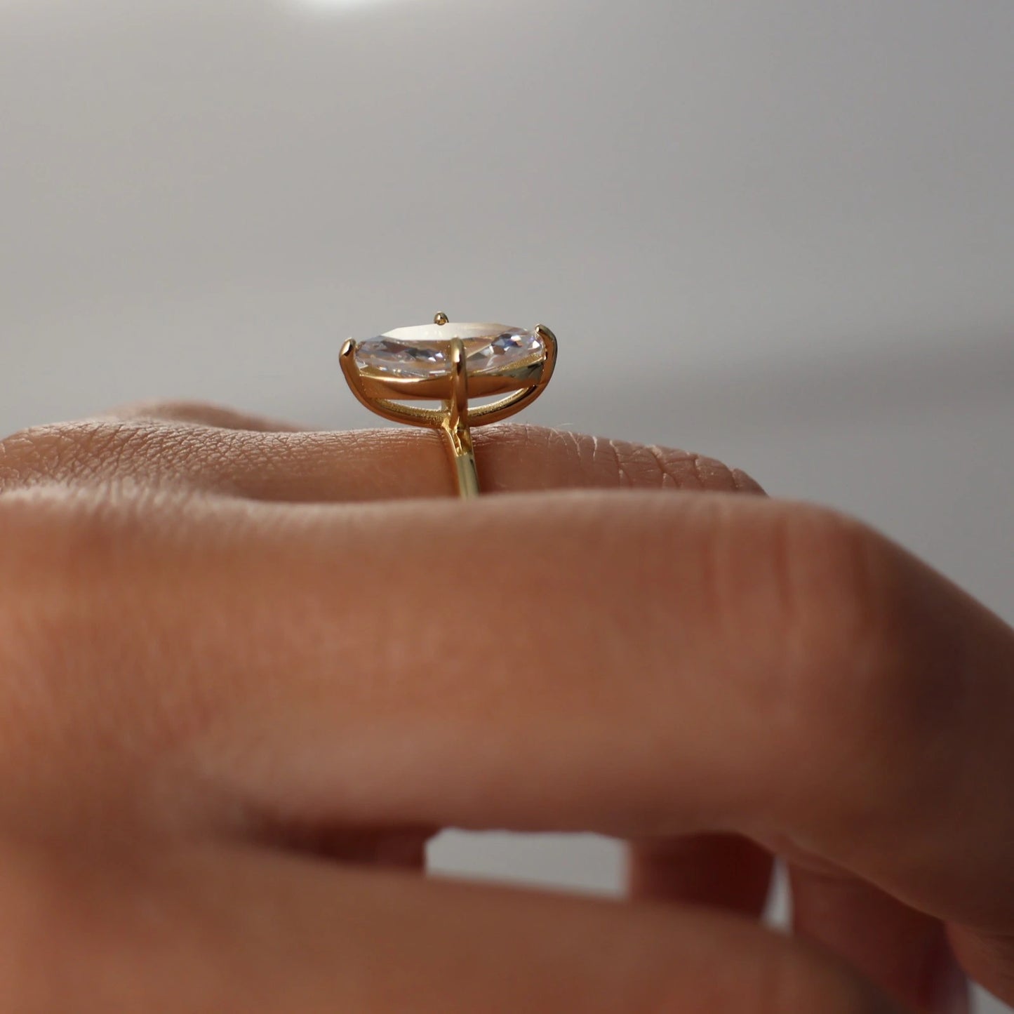 marquise shaped CZ solitaire ring in gold side profile