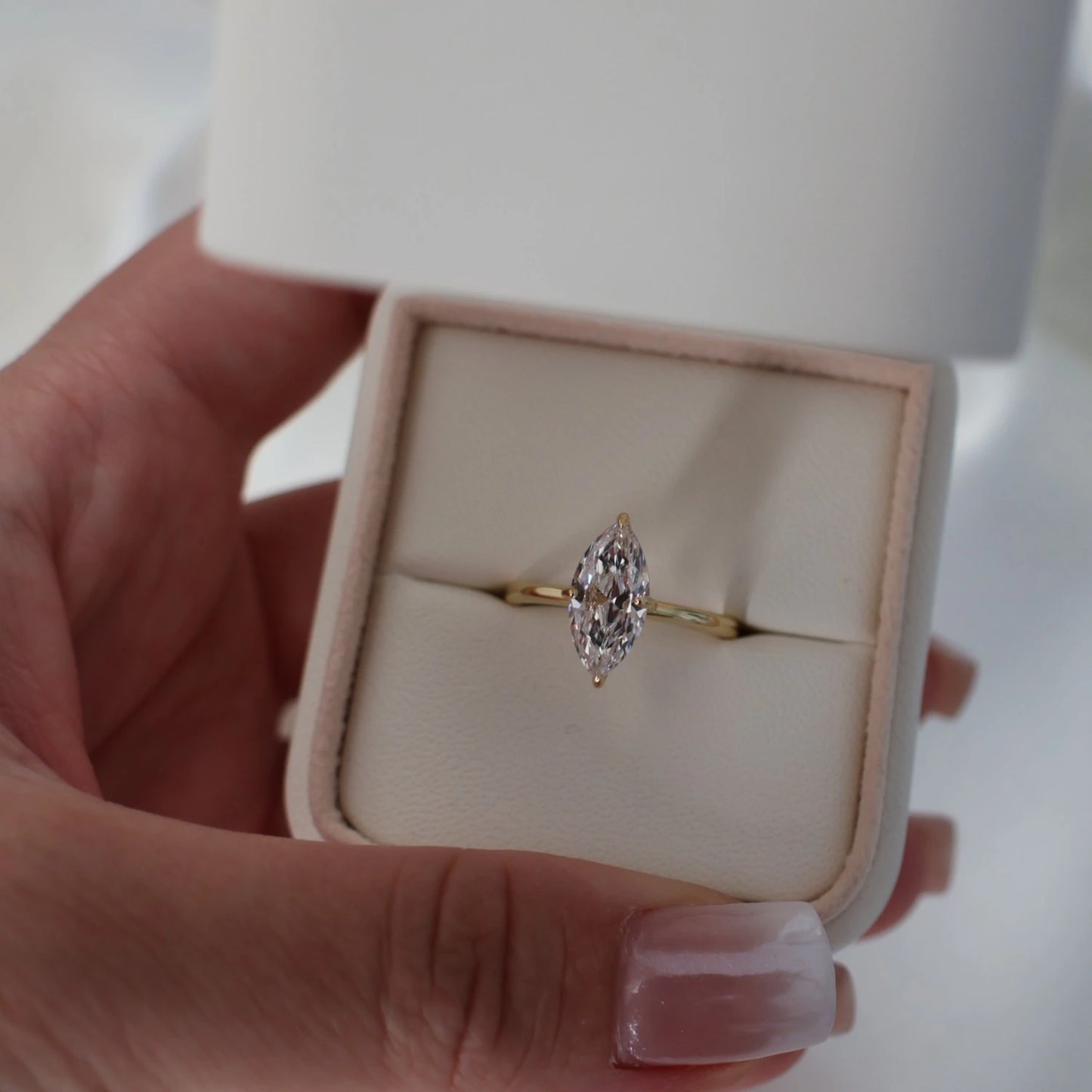 Marquise solitaire cubic zirconia engagement ring in gold in a proposal box