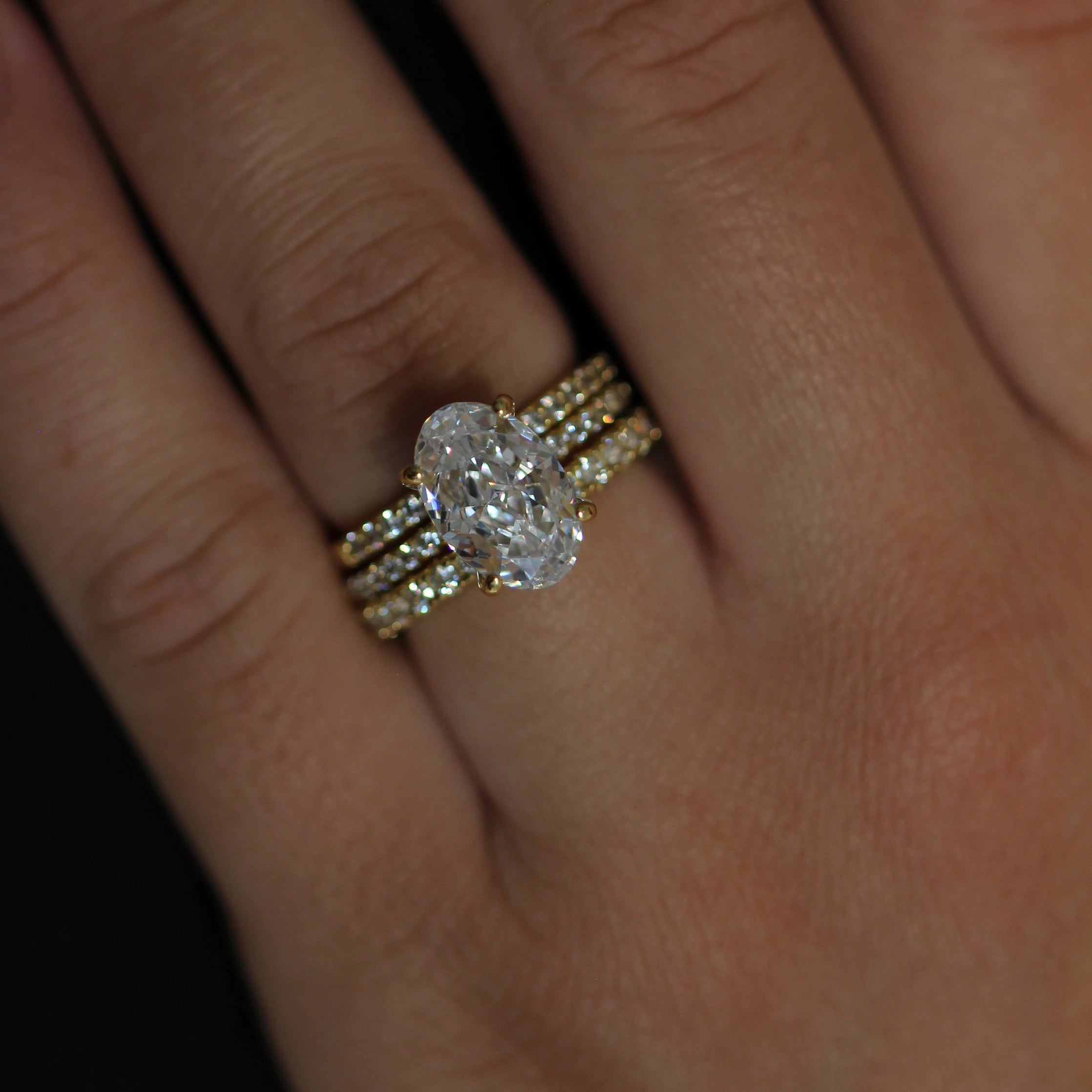 14K gold plated engagement ring featuring an oval crushed ice centre stone and pave band