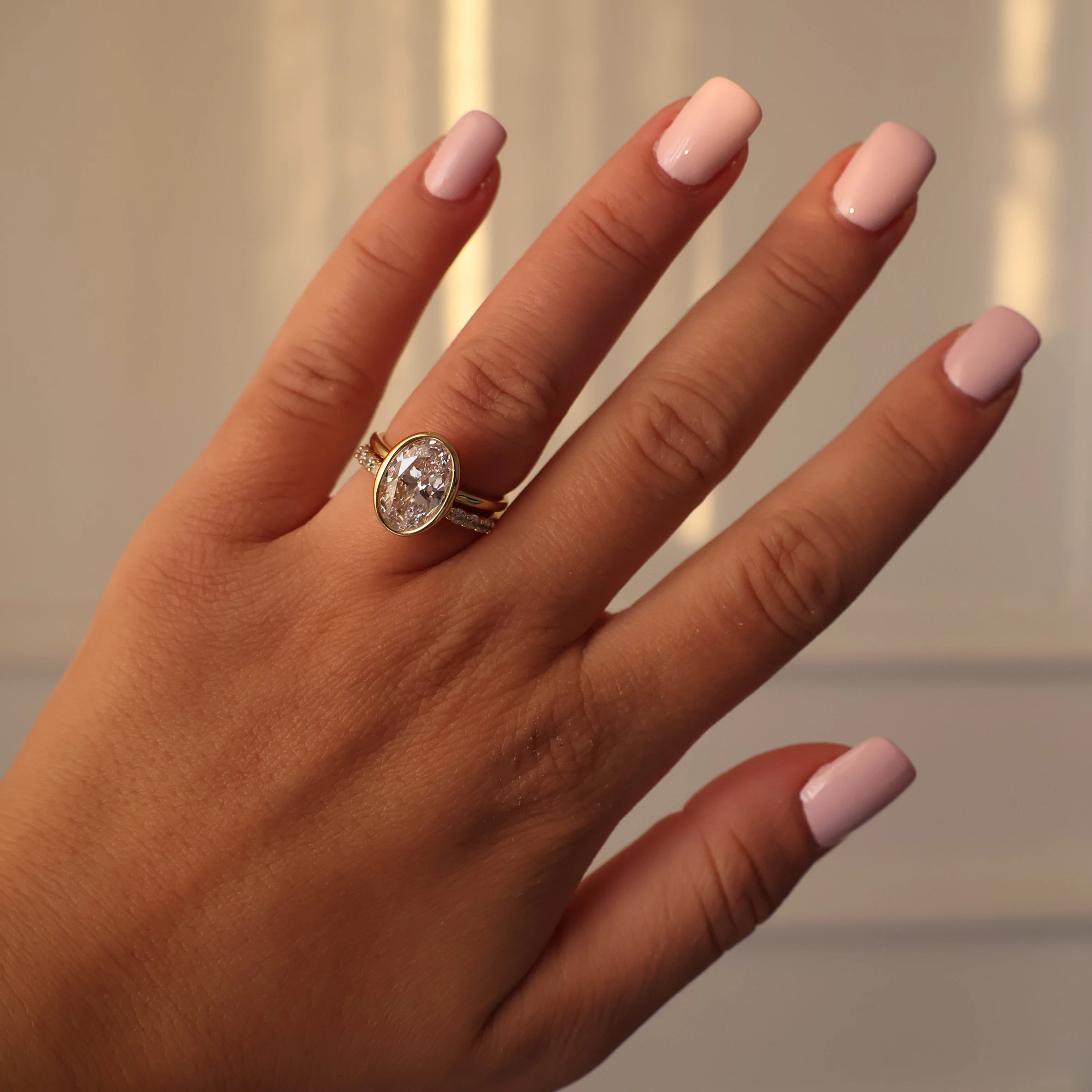 3.5 carat oval cut bezel set 14K gold plated ring