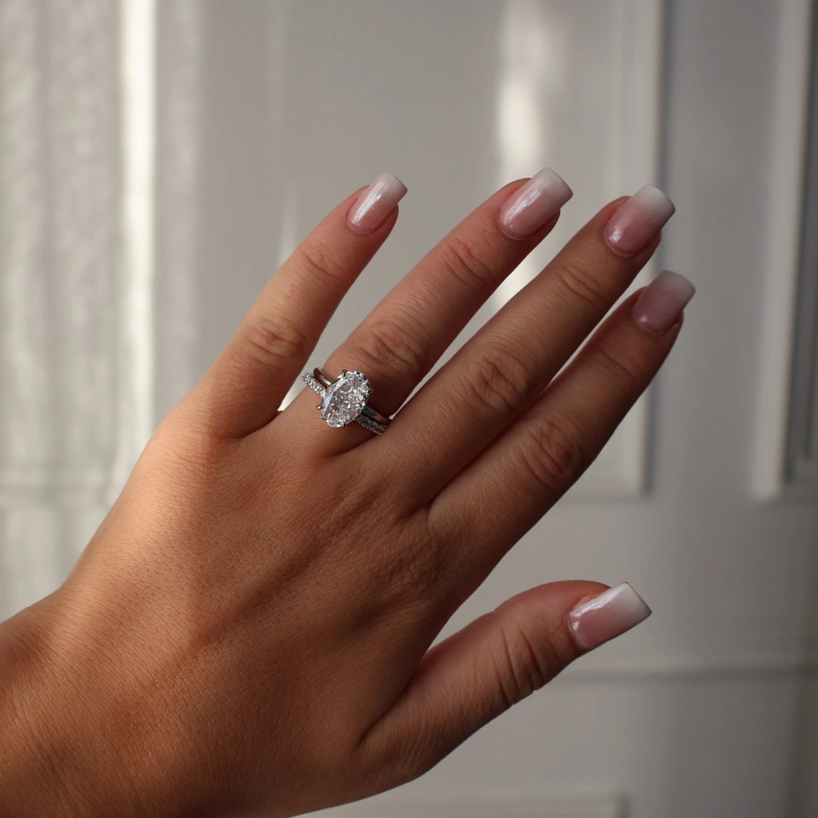 3.5 carat oval cut CZ silver ring featuring crushed ice stone with pave eternity band