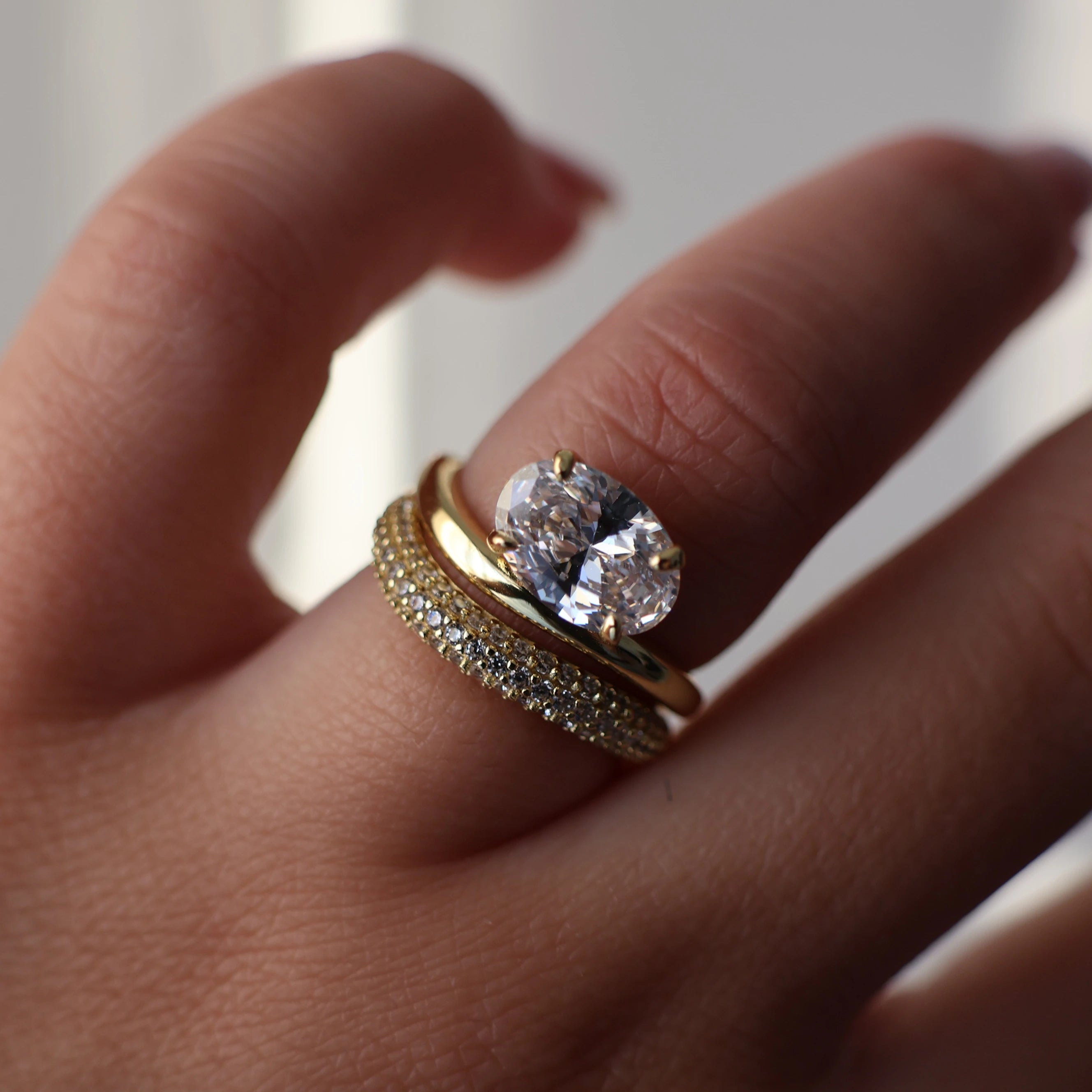 Oval cut east west gold wedding ring set