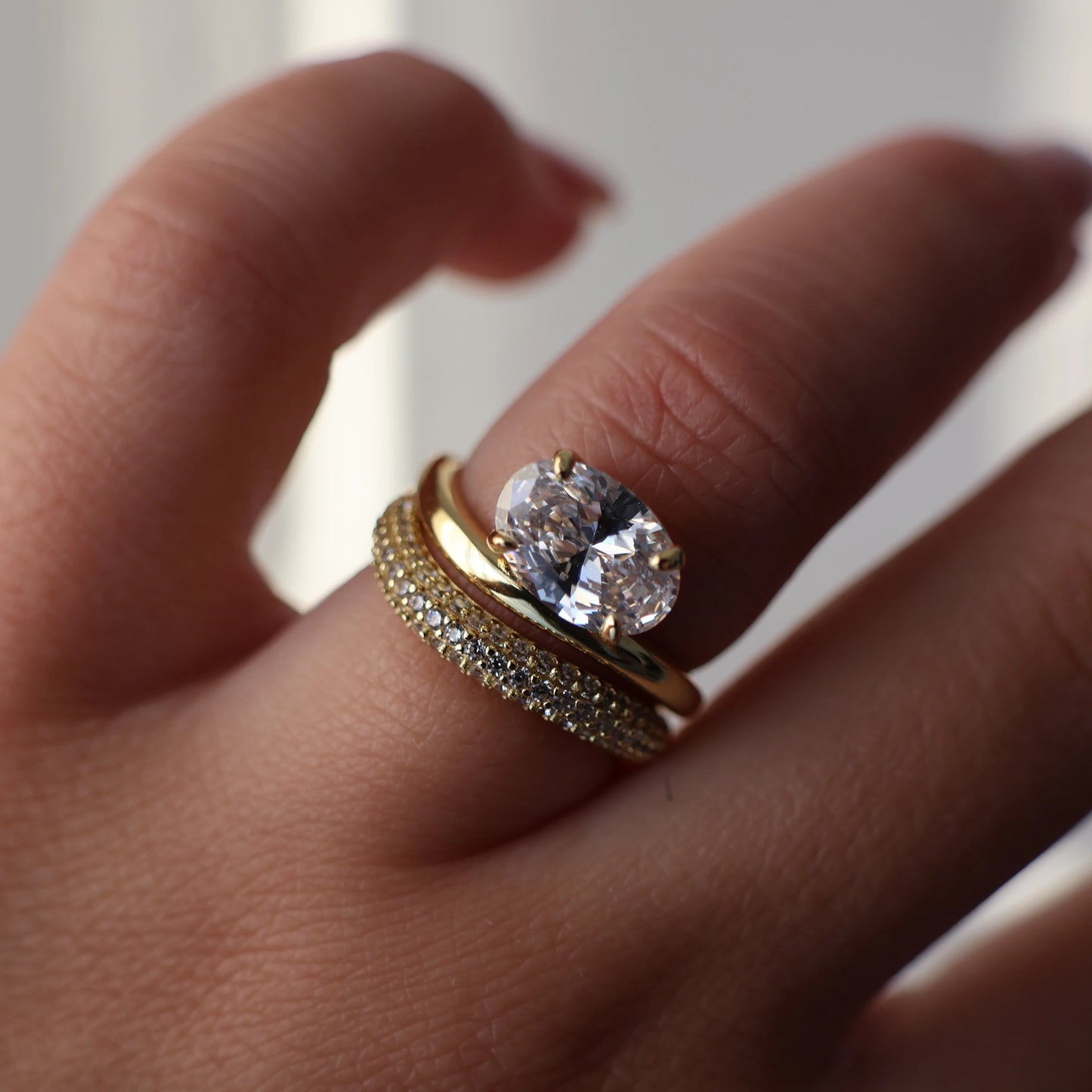 Oval cut east west gold wedding ring set