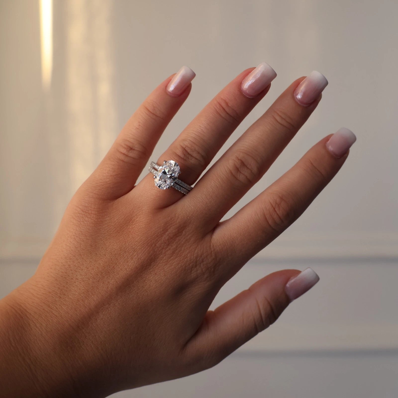 3.5 carat oval cubic zirconia hidden halo ring with pavé band