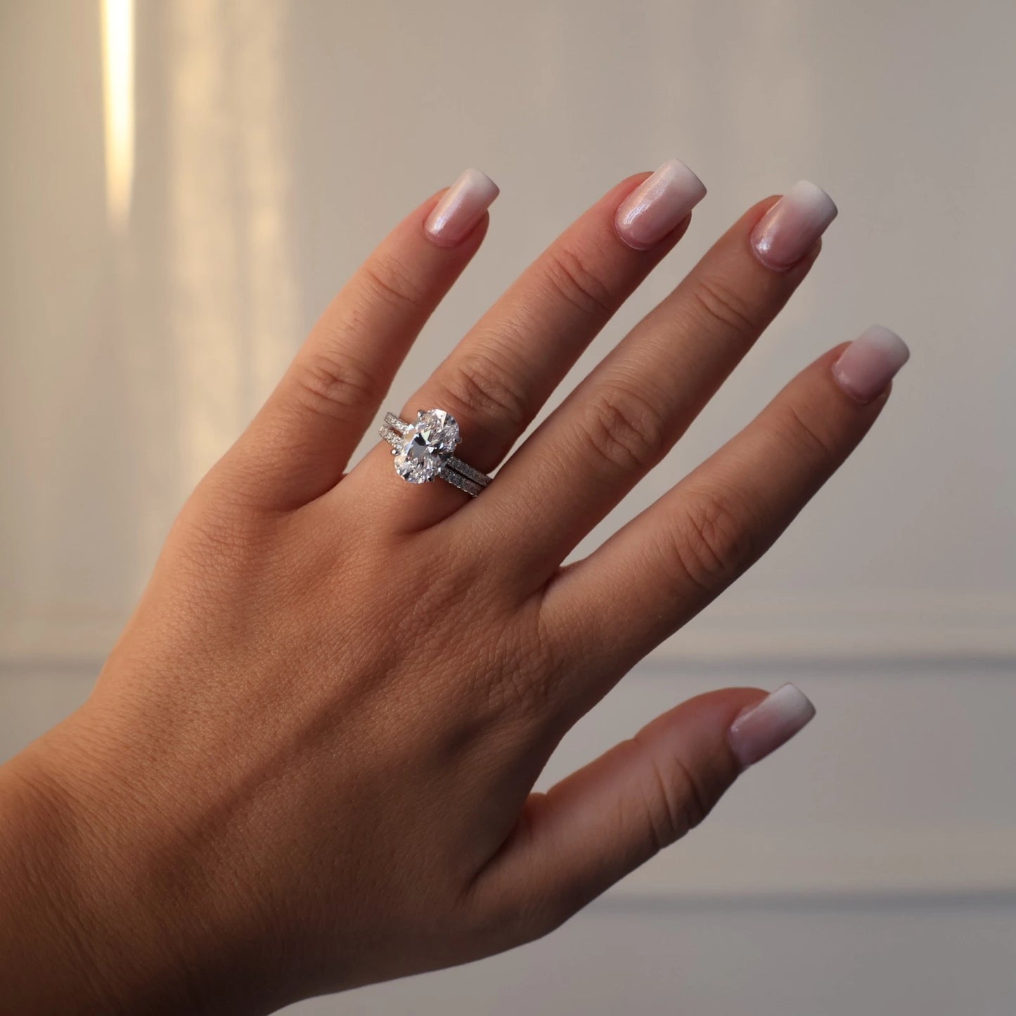 3.5 carat oval cubic zirconia hidden halo ring with pavé band