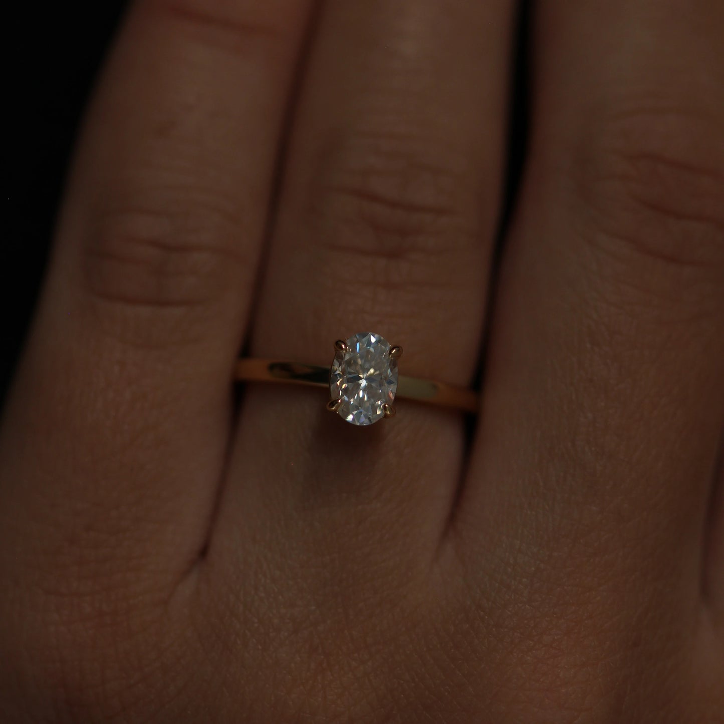 Oval 1 carat moissanite engagement ring set on 14k gold filled band