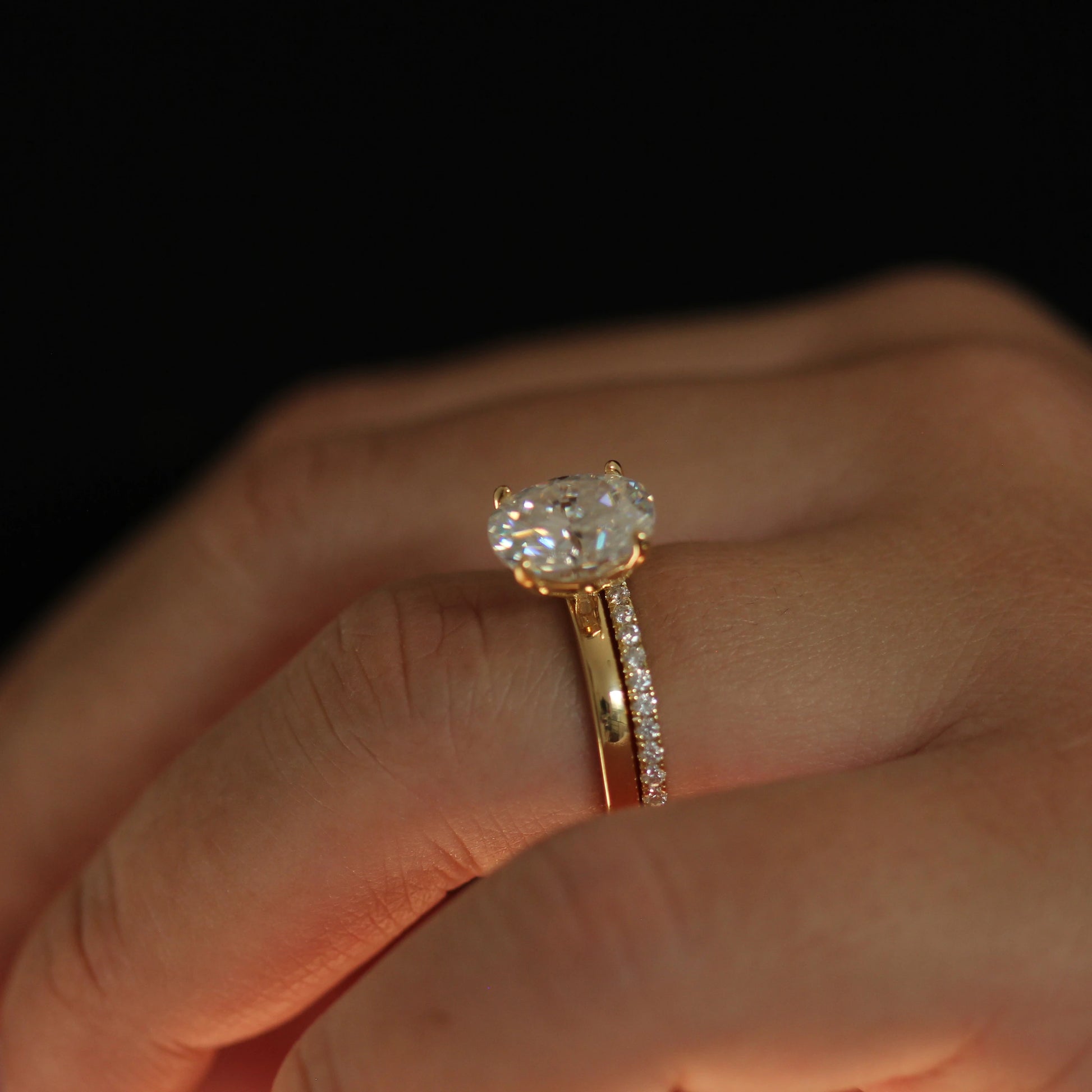 oval 3 carat moissanite solitaire engagement ring stacked with half eternity band in 14k gold filled