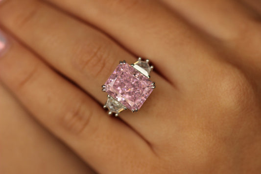 pink engagement ring on hand