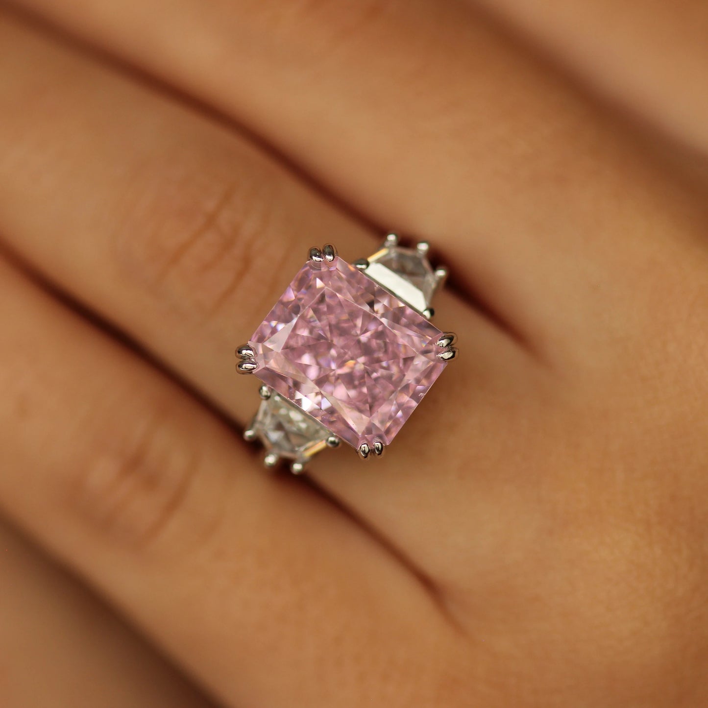 pink engagement ring on hand