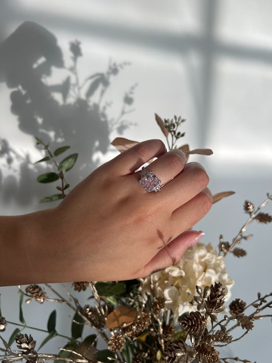 silver rectangle travel ring with pink centre stone
