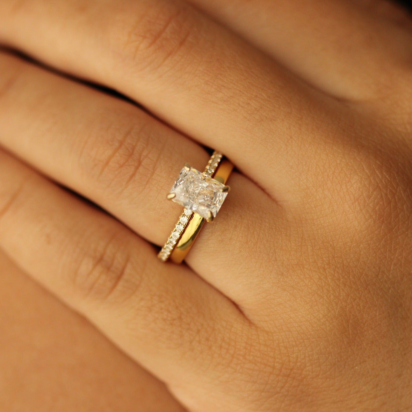 18k Plain gold wedding band with radiant cut ring on hand