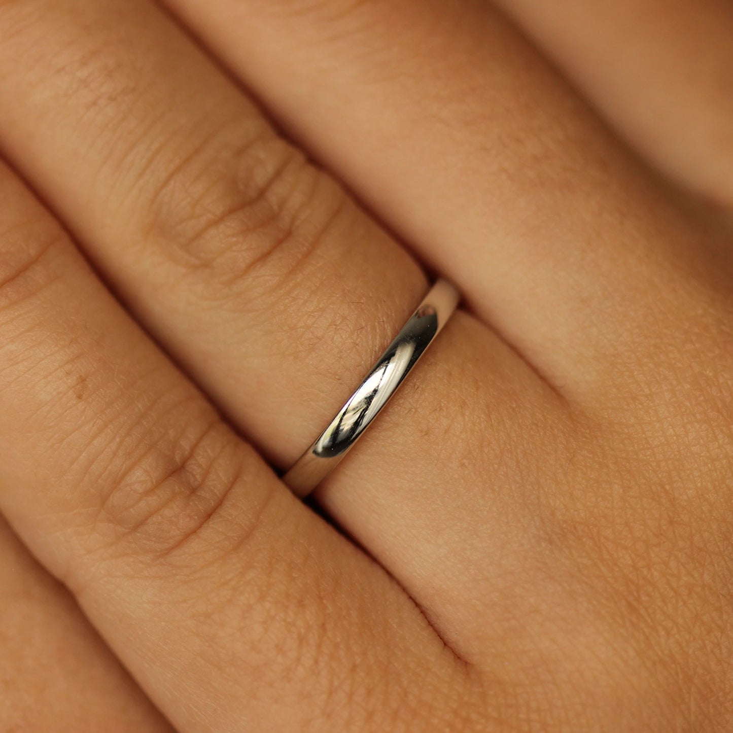 girl posing with silver wedding band