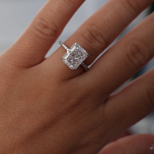 3.5 ct radiant cut CZ ring with pavé band on hand