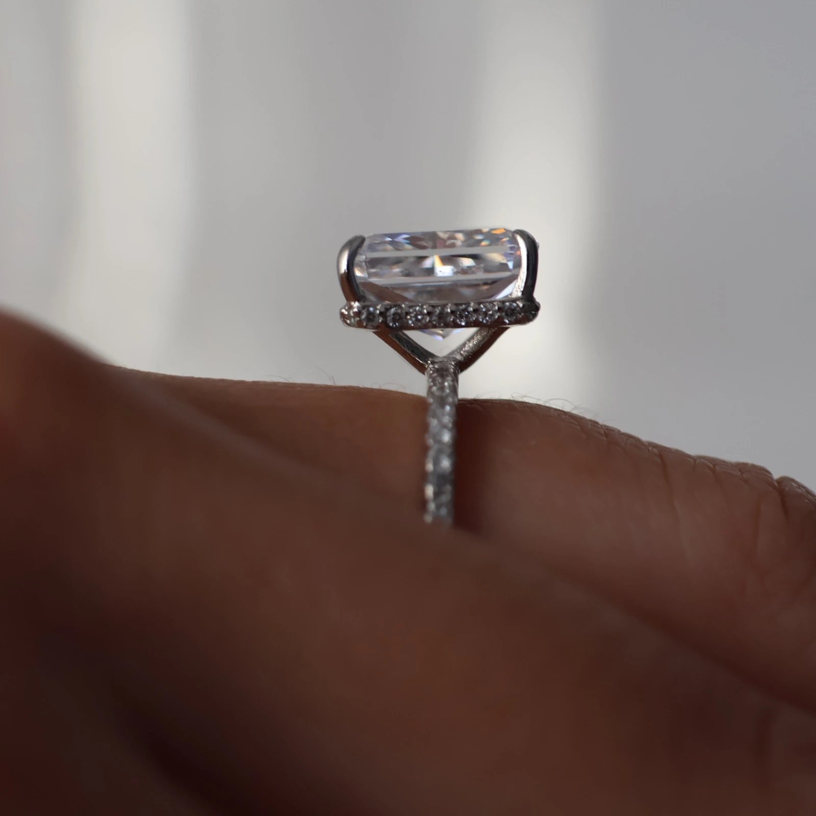 3.5 carat radiant cut CZ ring with hidden halo and pavé band