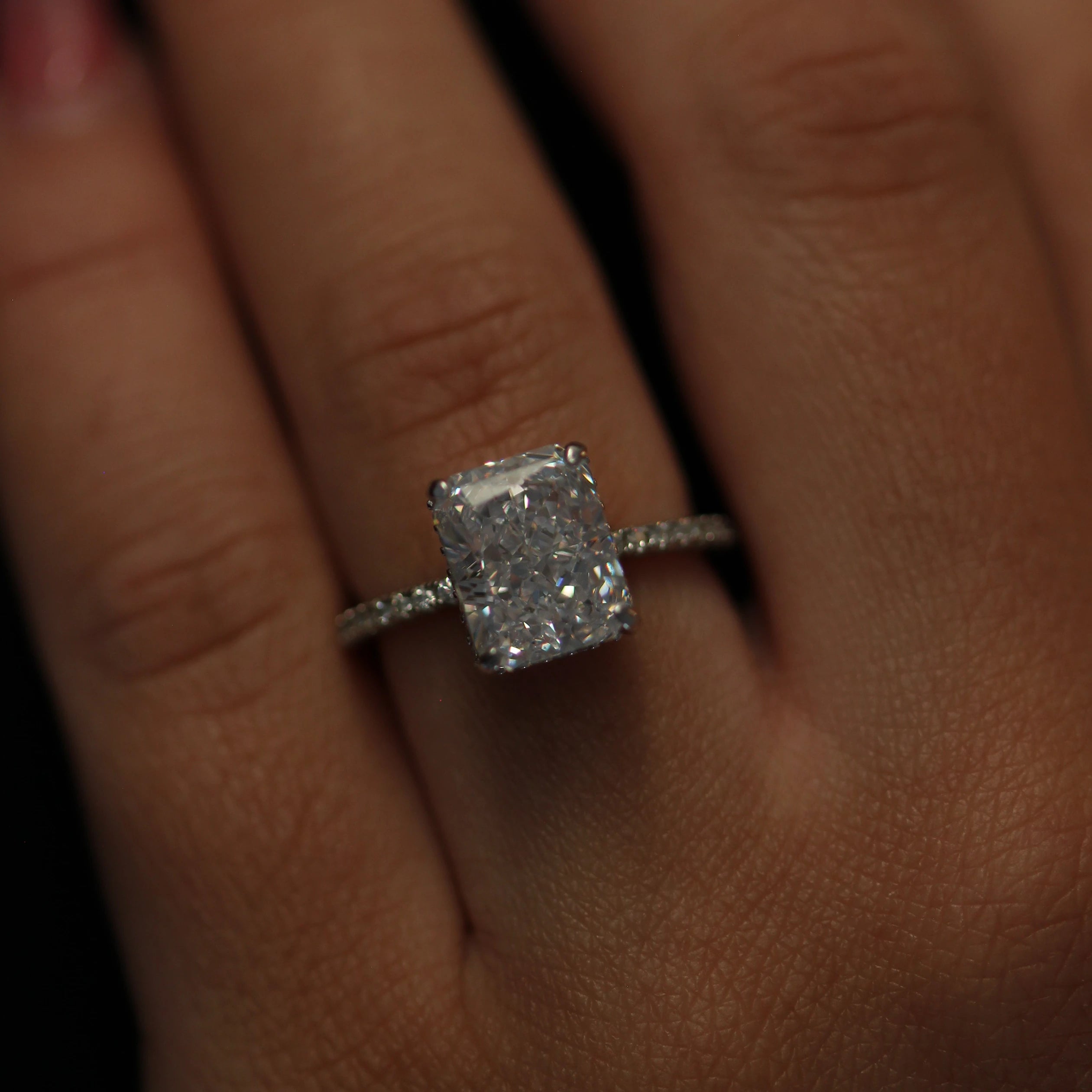 Radiant cut 3.5 carat silver ring with side halo and pave band