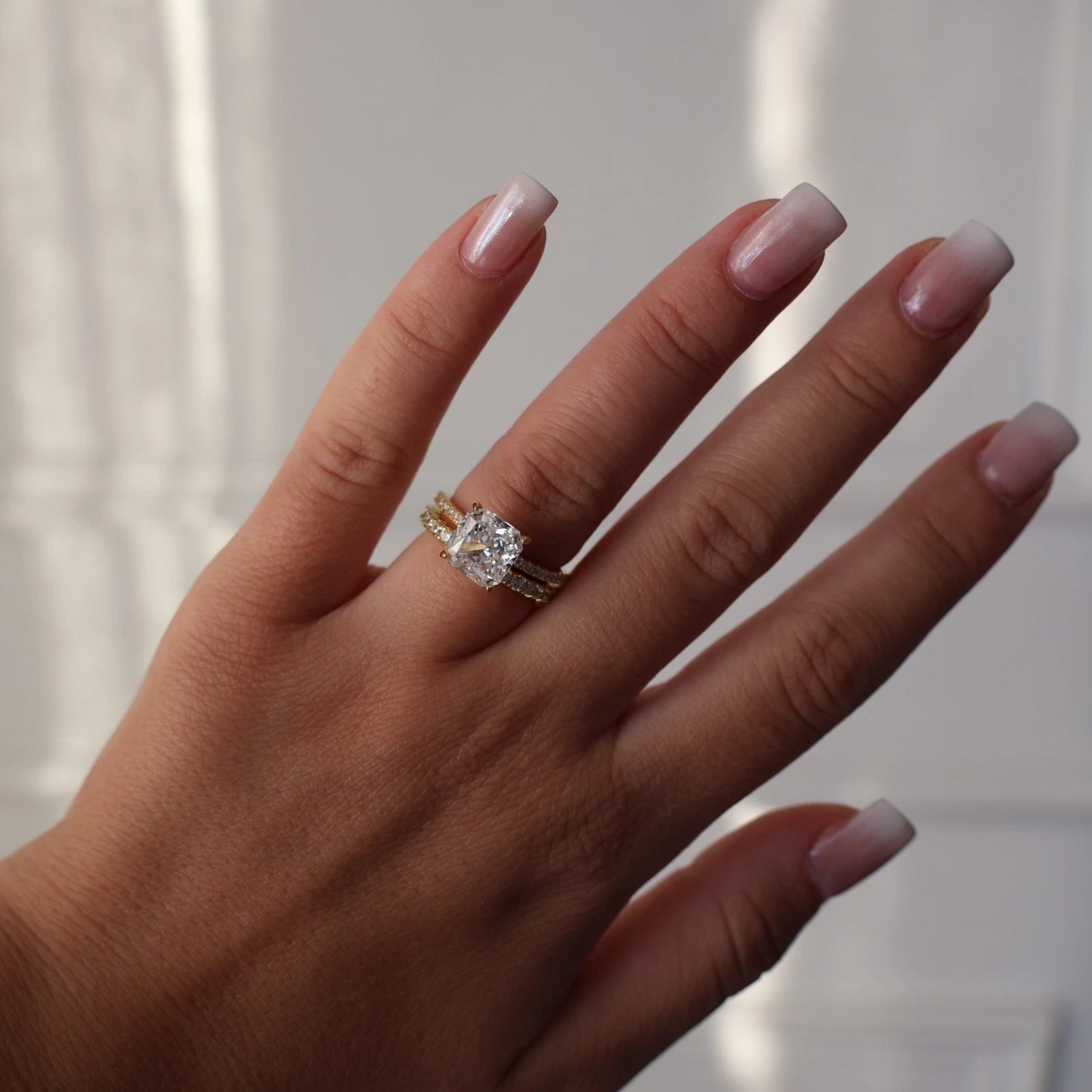 3ct radiant square ring stacked alongside eternity band