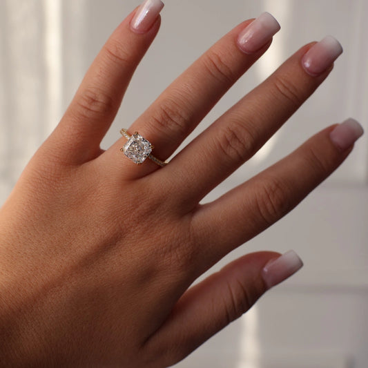 Radiant square 3ct ring featuring a pavé band