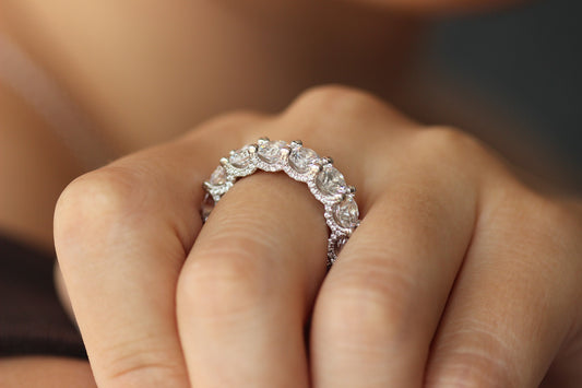round silver stacker ring on hand side profile