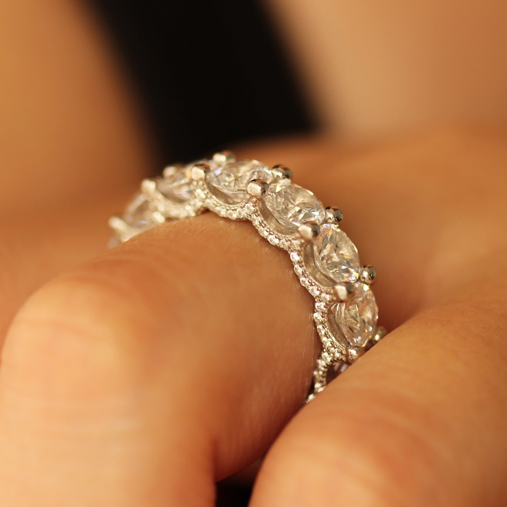 round silver stacker ring on hand side profile
