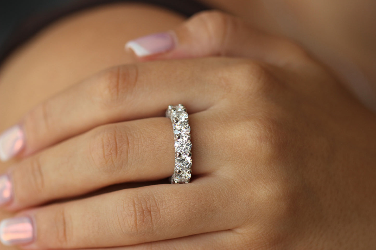 round silver stacker ring on hand