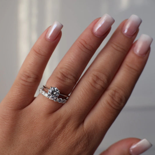 1.3 carat round solitaire ring stacked with round eternity band in silver