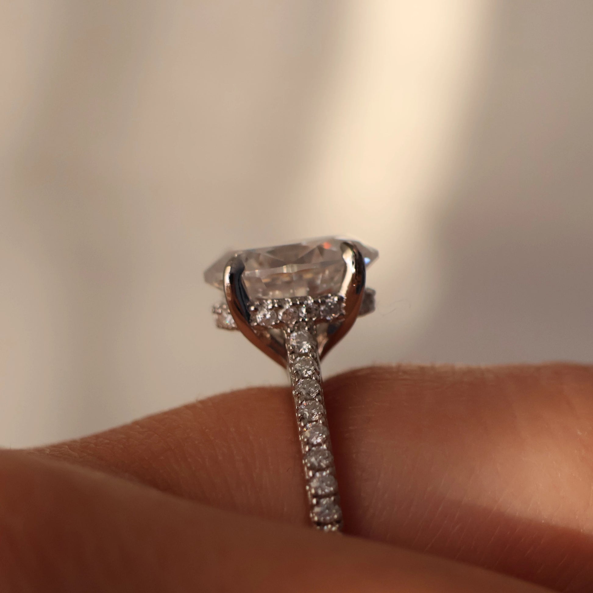 side halo on a 3ct oval moissanite ring