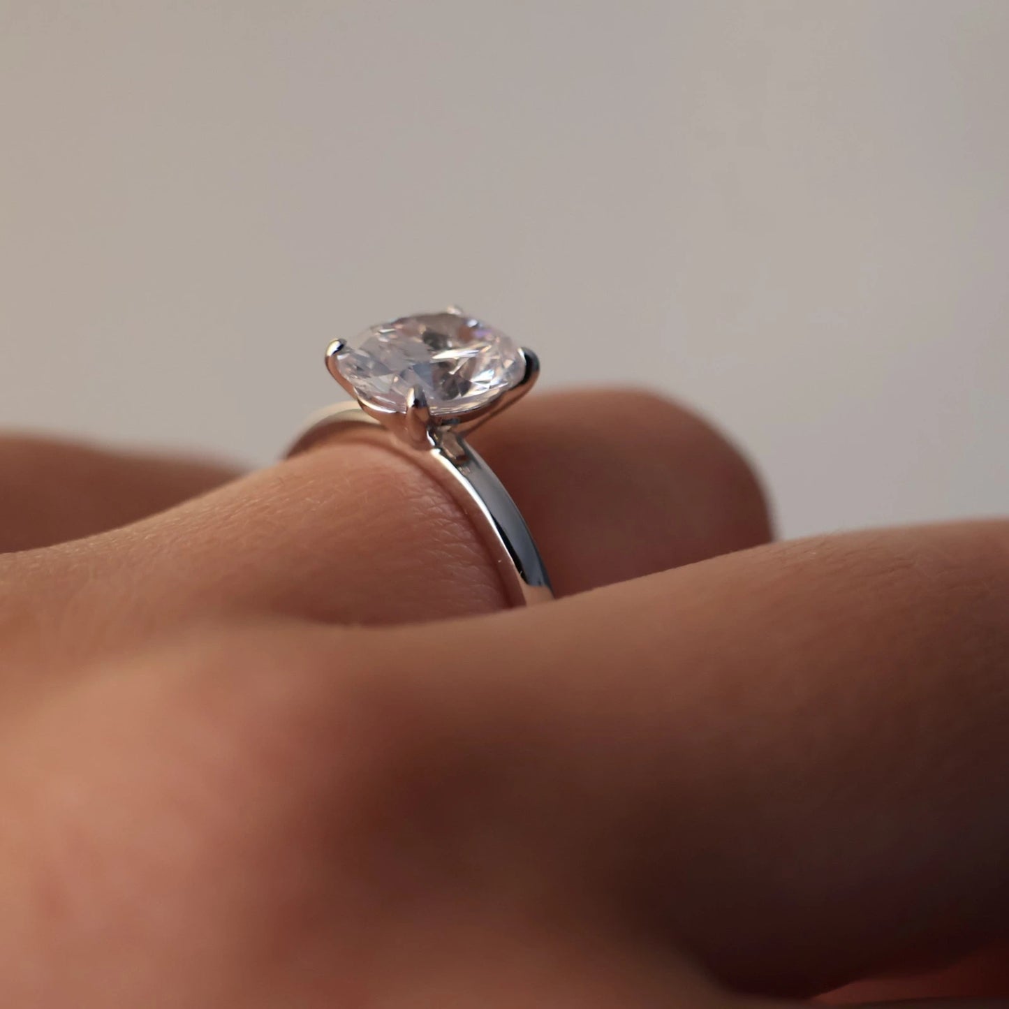 Silver solitaire engagement ring with a 2 carat oval stone