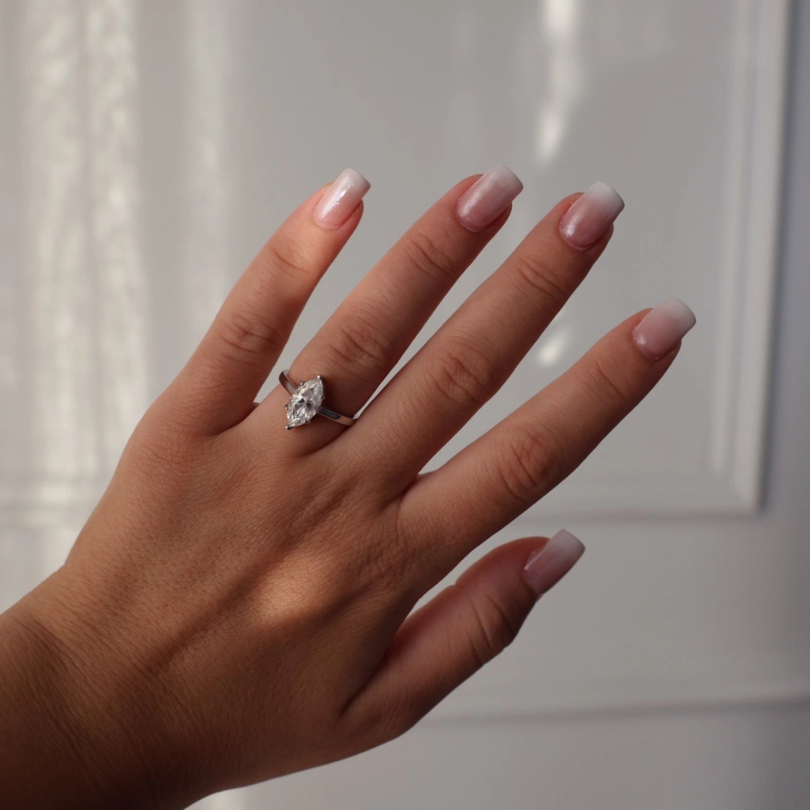 Silver solitaire ring with 2 carat marquise moissanite