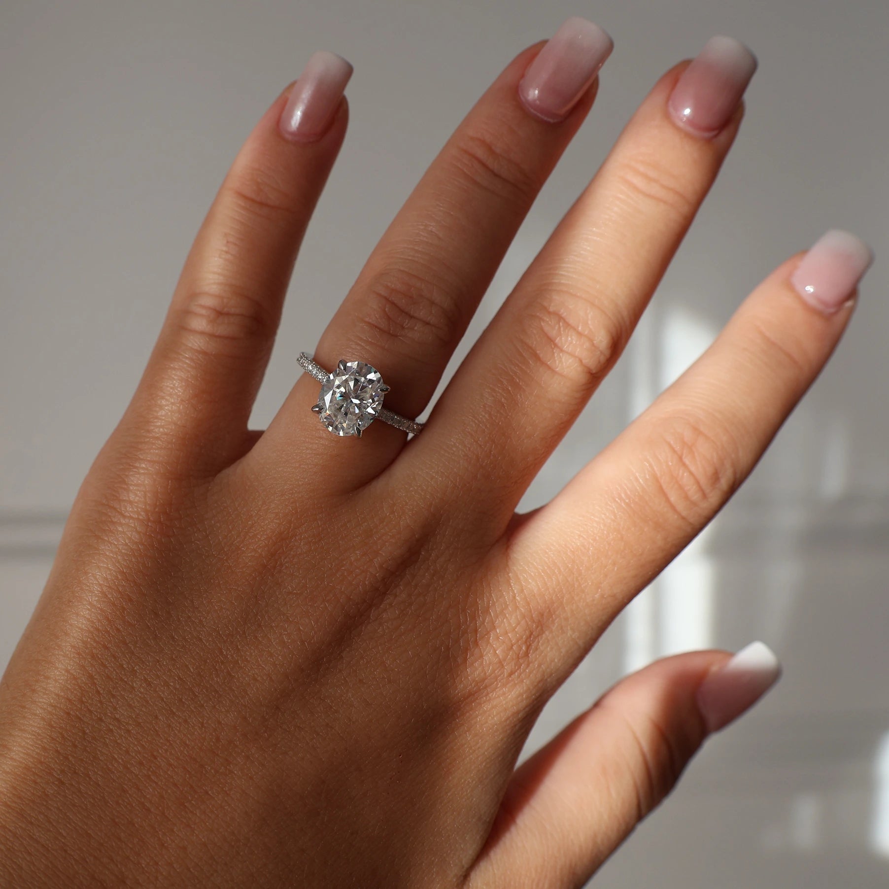 Silver 3ct oval moissanite ring with pavé band