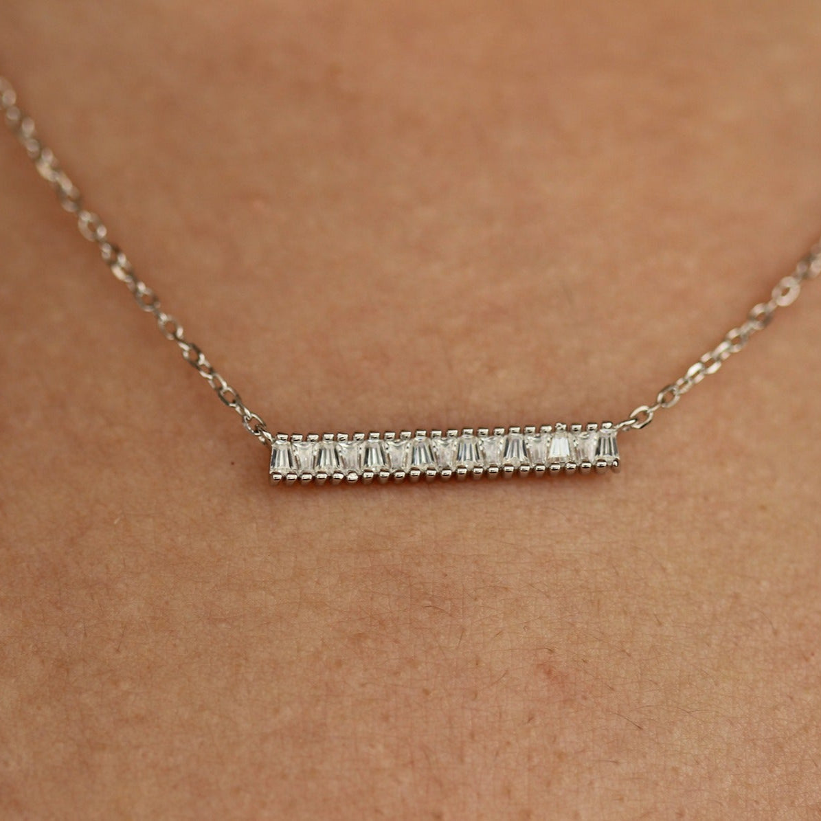 silver bar necklace on model