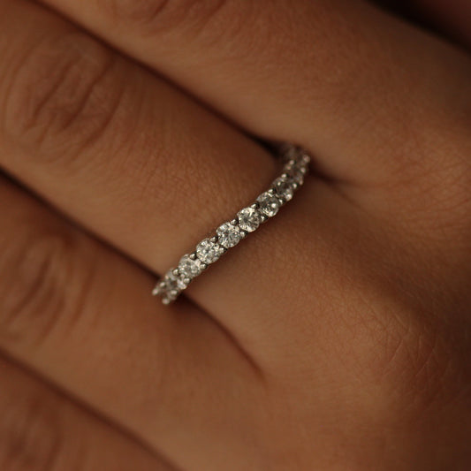 Silver curved stacker ring on hand