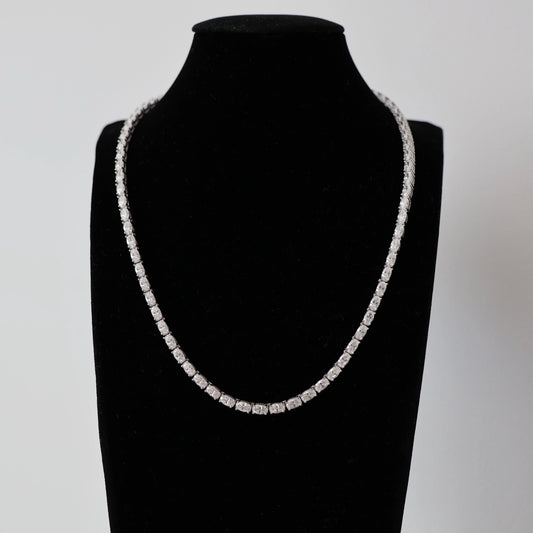 silver east west oval moissanite tennis necklace on mannequin