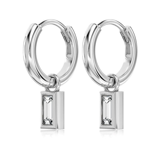 silver hoop earrings  emerald charm on white background