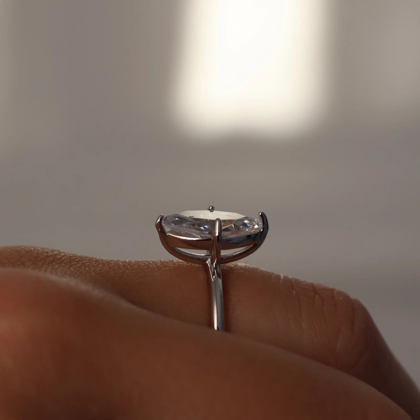Side view of silver marquise solitaire ring