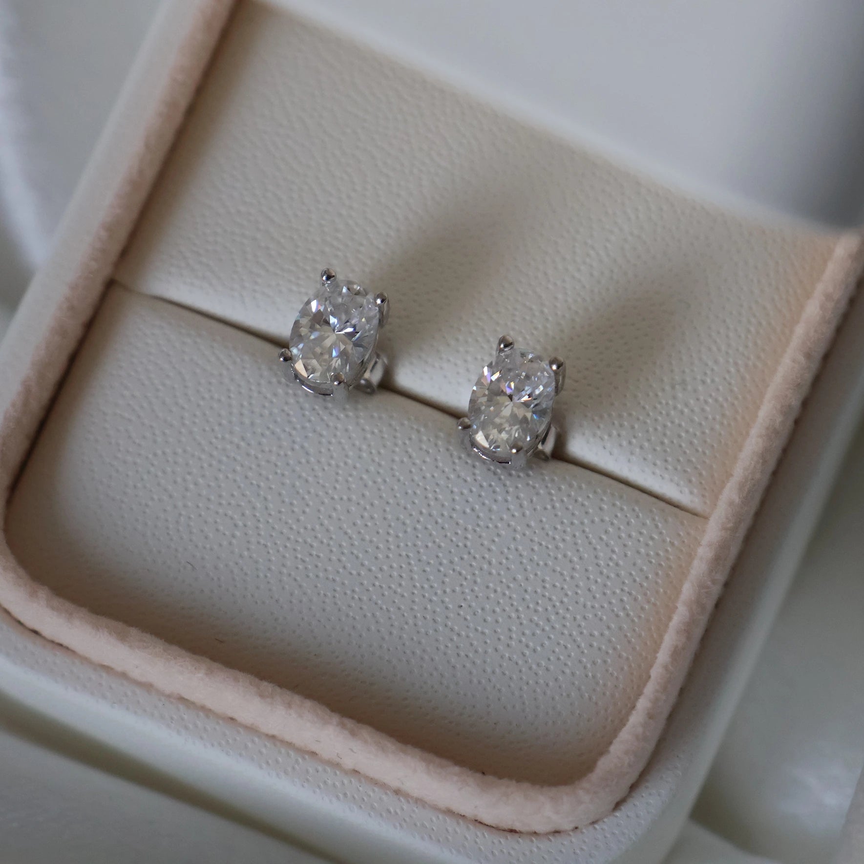 Silver oval cut moissanite earrings with 2 TCW total carat weight