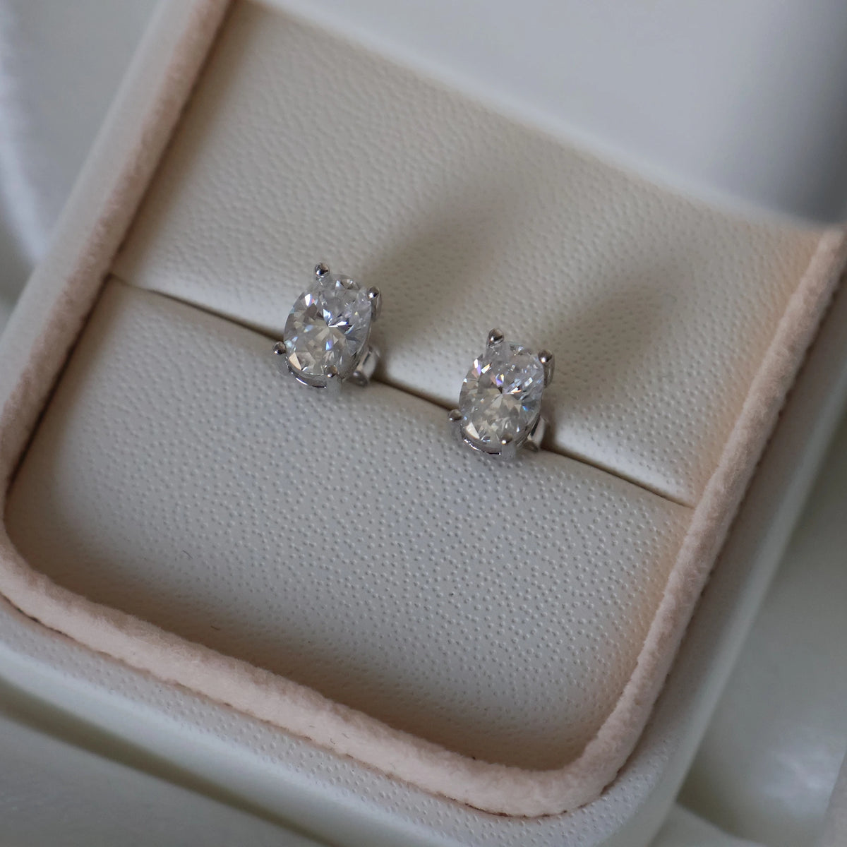 Silver oval cut moissanite earrings with 2 TCW total carat weight