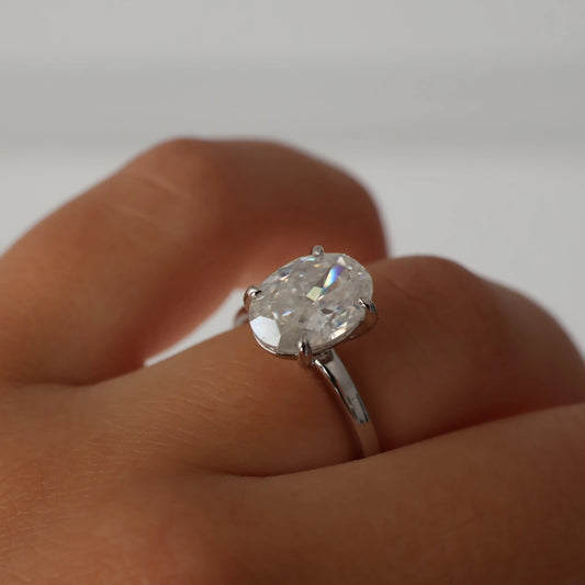 Silver oval moissanite engagement ring featuring a 4ct crushed ice stone