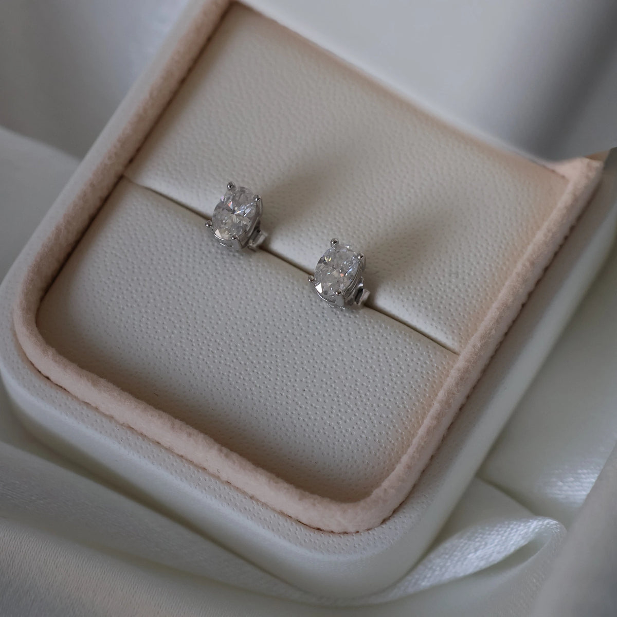 silver oval moissanite stud earrings with 1 TCW total weight