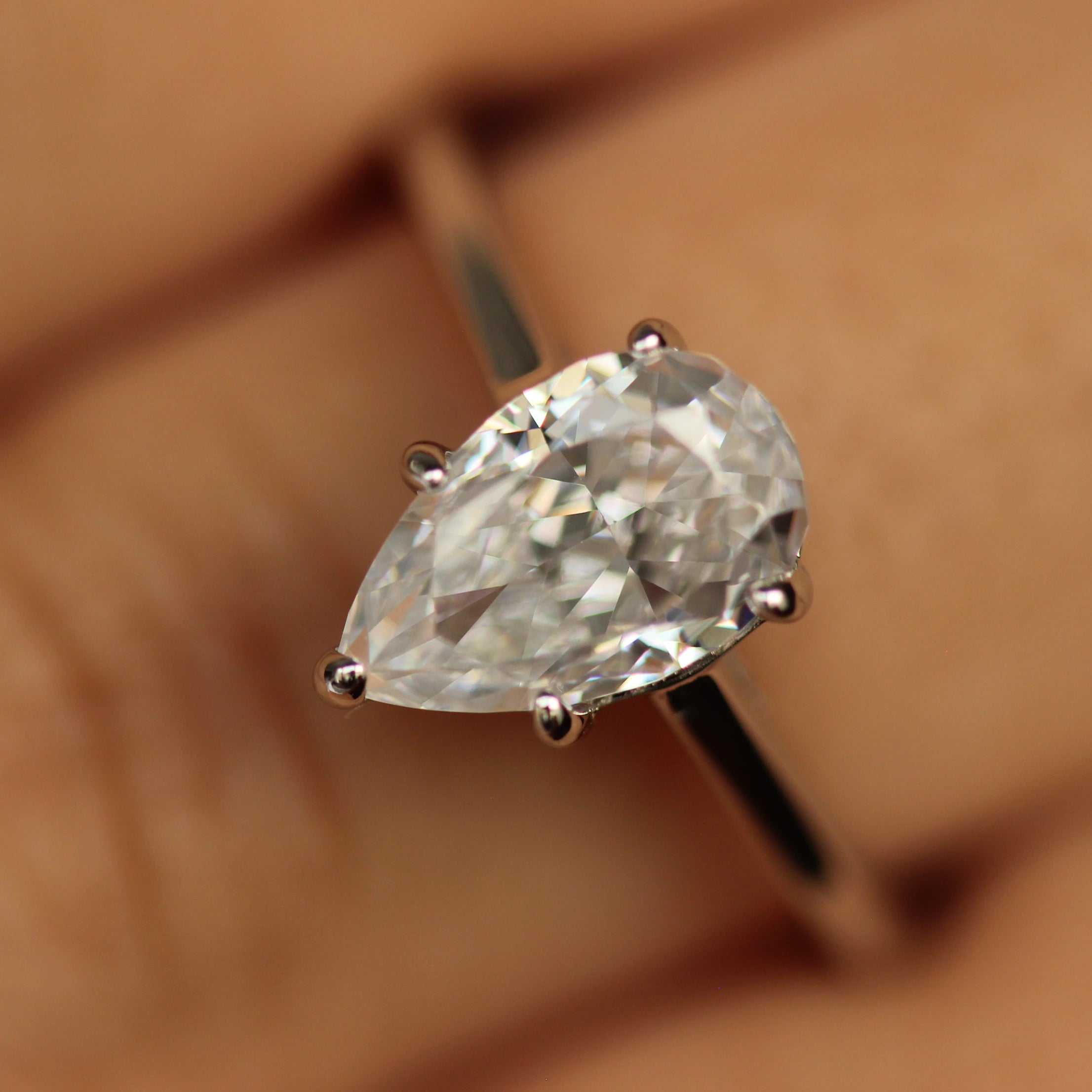 engagement pear shaped ring silver on hand